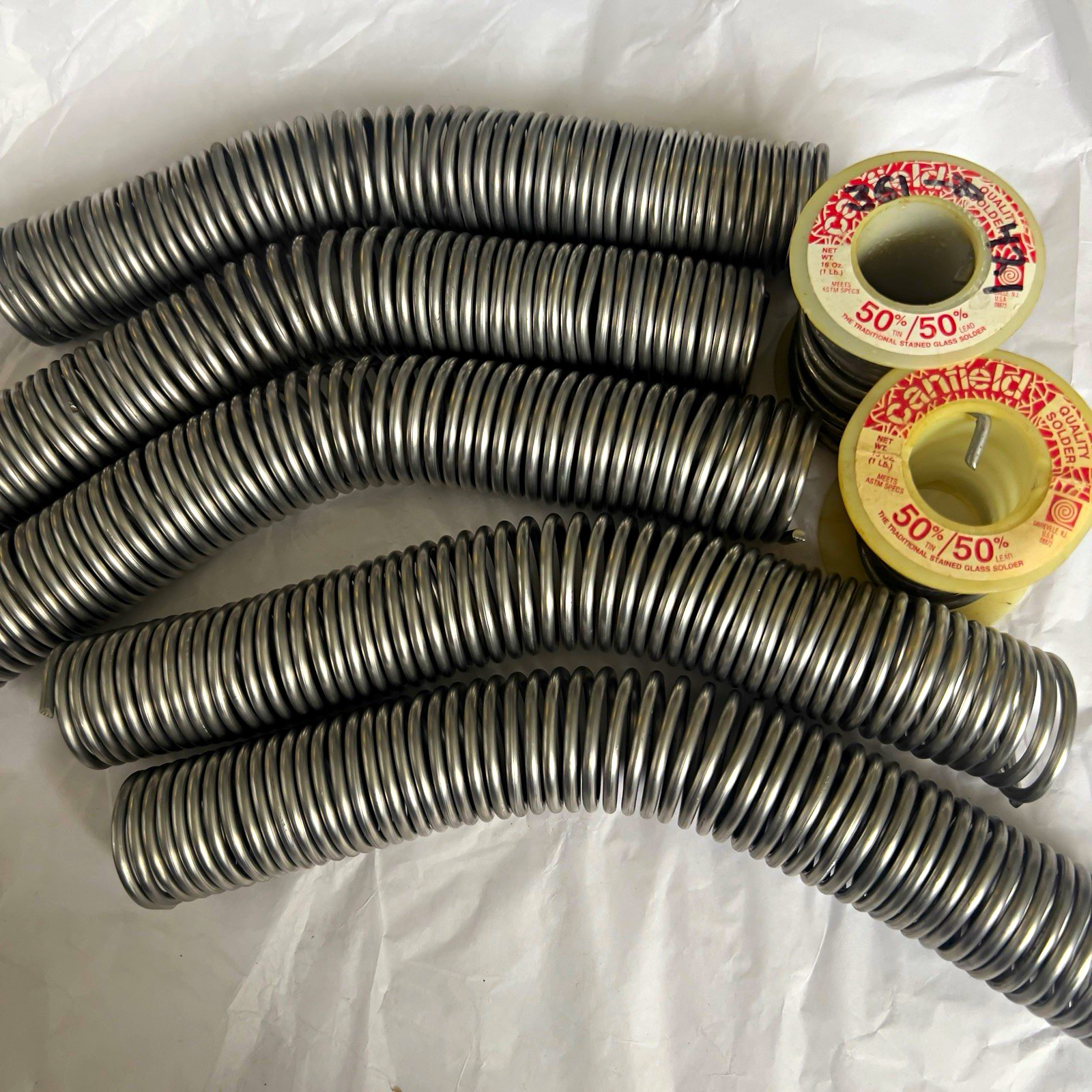 Canfield 50/50 Solder for Stained Glass 1lb Coils. New- no spool. Canfield 50/50 Solder for Stained Glass 1lb Coils. New- no spool.