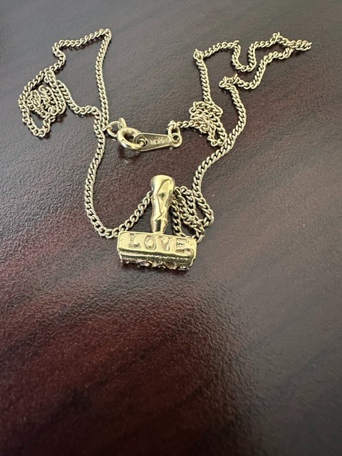 Vintage 1980s Avon Signed Gold Tone Chain Necklace LOVE Seal Stamp Pendant. Vintage 1980s Avon Signed Gold Tone Chain Necklace LOVE Seal Stamp Pendant.