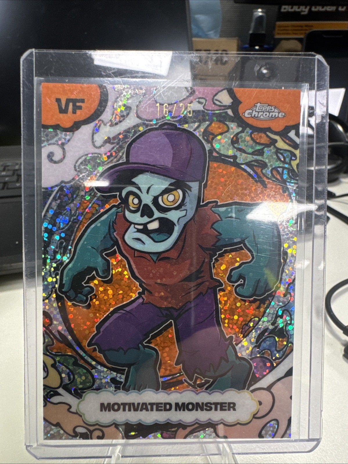 2026 Topps Chrome VeeFriends Motivated Monster Orange Manga /25 Speckle #SSA-2 2026 Topps Chrome VeeFriends Motivated Monster Orange Manga /25 Speckle #SSA-2