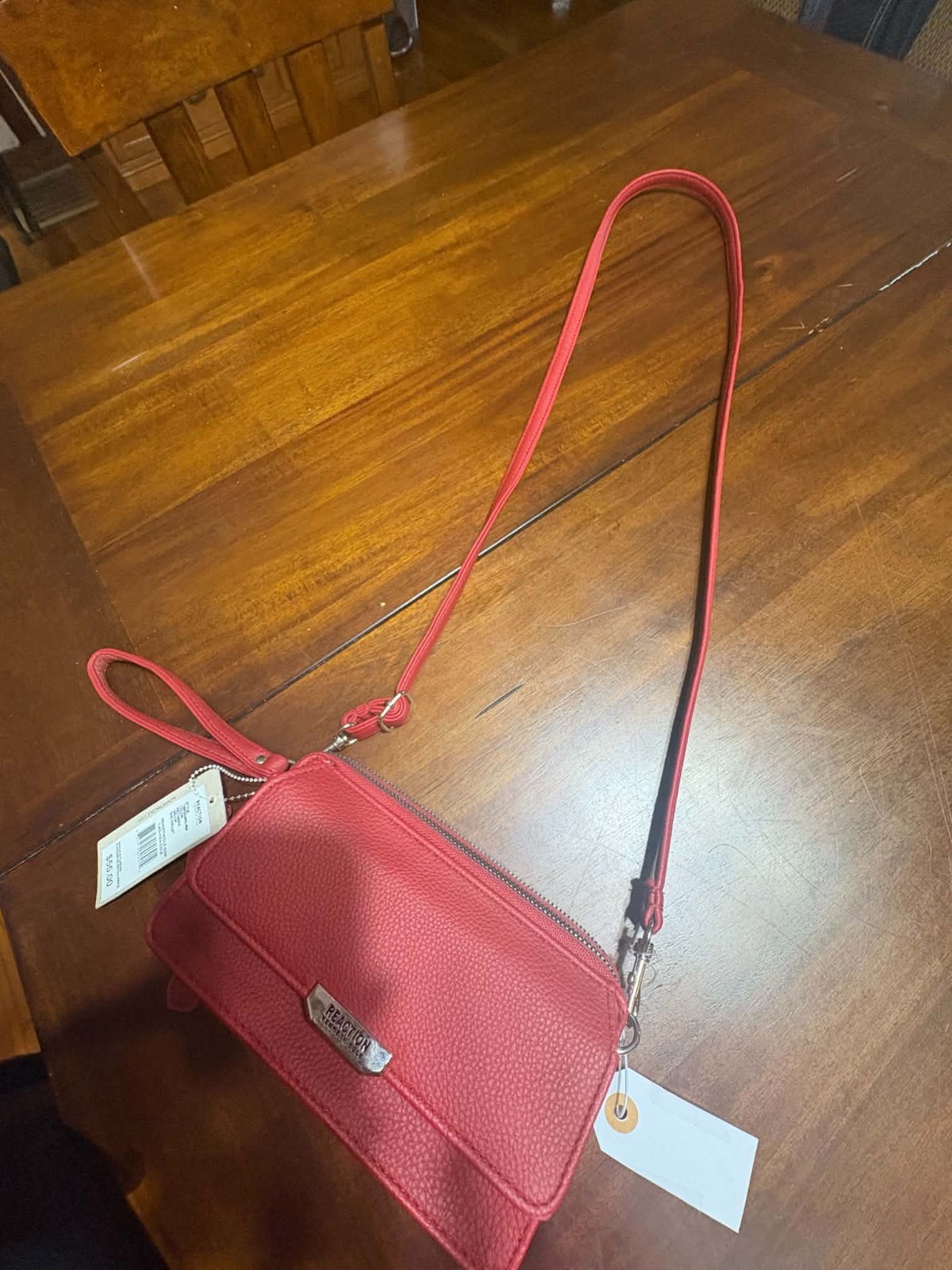 KENNETH COLE REACTION CLUTCH PURSE, NEW, RED LEATHER, DIMS 7.5 L X 4 H X 2.5 W KENNETH COLE REACTION CLUTCH PURSE, NEW, RED LEATHER, DIMS 7.5 L X 4 H X 2.5 W