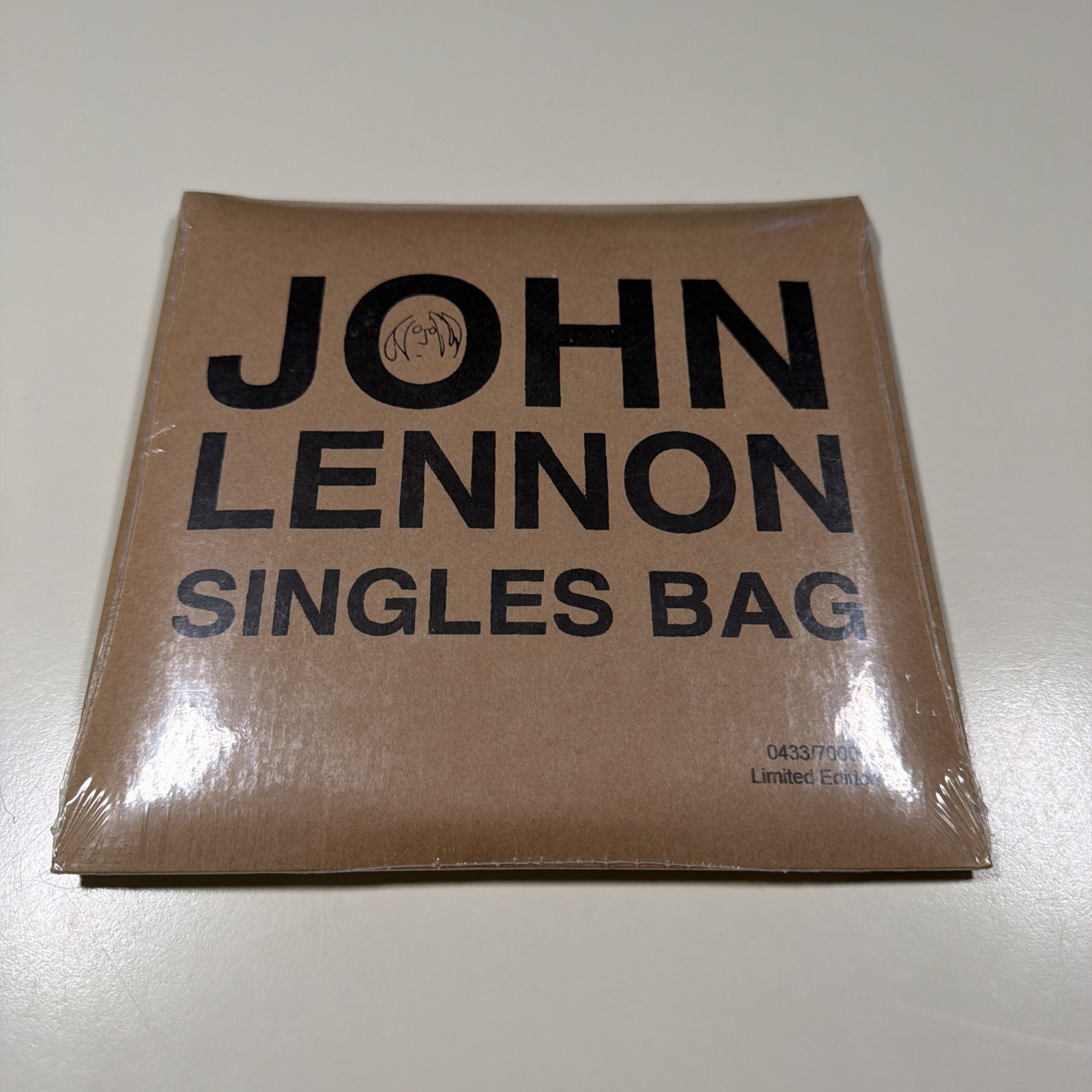 2010 RSD John Lennon Sealed Bag Of Singles #0433/7000 Mint, Sealed RARE 2010 RSD John Lennon Sealed Bag Of Singles #0433/7000 Mint, Sealed RARE
