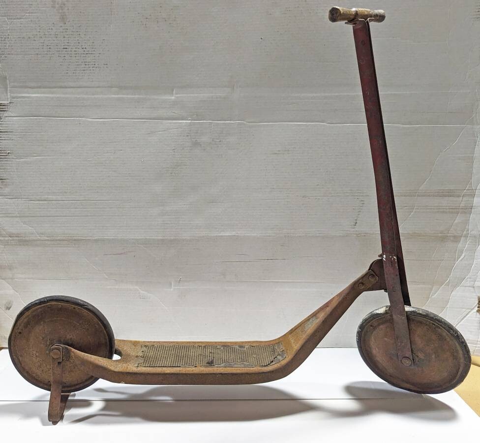Early 1900s antique ride-on toy kick push scooter steel frame wood handle Early 1900s antique ride-on toy kick push scooter steel frame wood handle