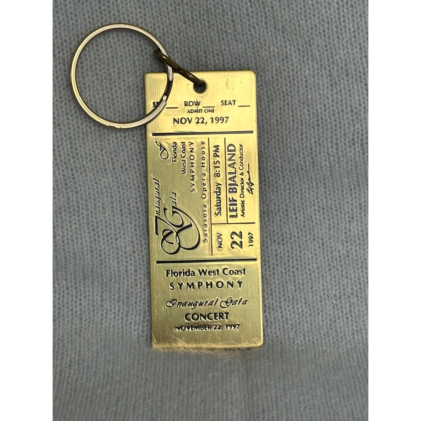 Vintage 1997 Florida West Coast Symphony Inaugural Gala Brass Ticket Keychain.