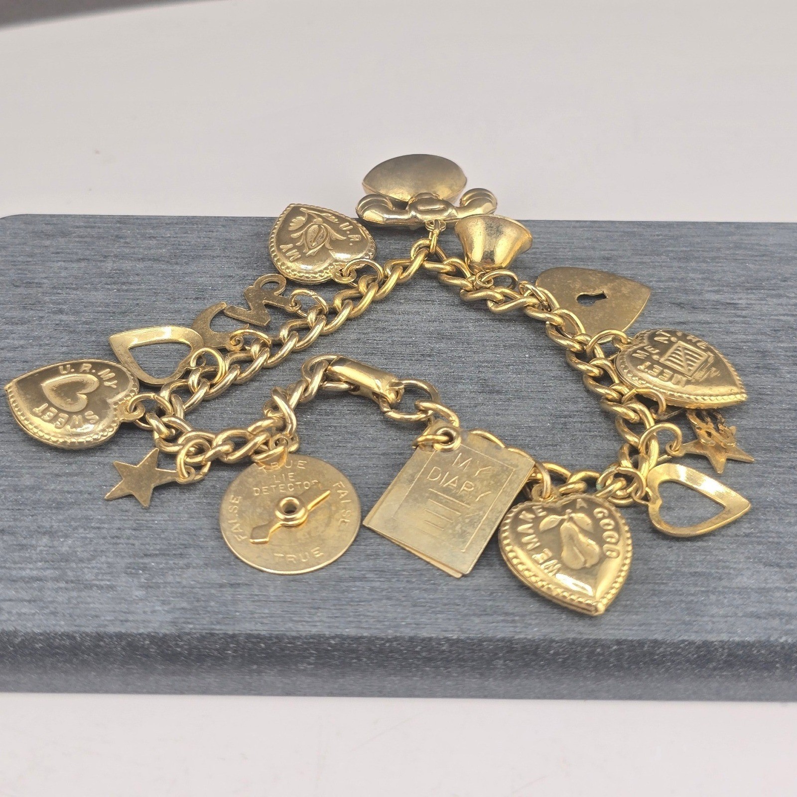 Vintage Coro Charm Bracelet Gold Tone Heart Star Telephone Diary Spinner 7.25in