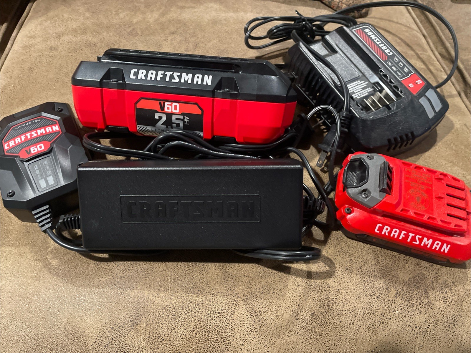 CRAFTSMAN V60 LITHIUM BATTERY AND CHARGER CMCB6025 & V20 Charger. AS Is Lot CRAFTSMAN V60 LITHIUM BATTERY AND CHARGER CMCB6025 & V20 Charger. AS Is Lot