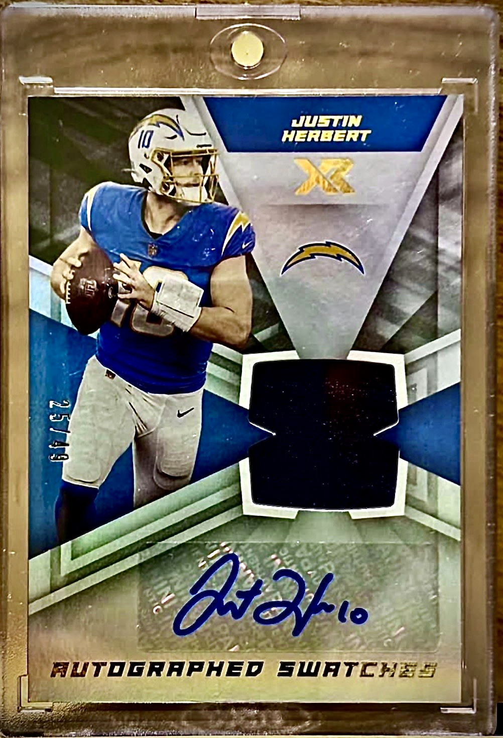 2021 Panini XR Justin Herbert Autographed Swatches Auto Jersey AUS-JHE 25/49