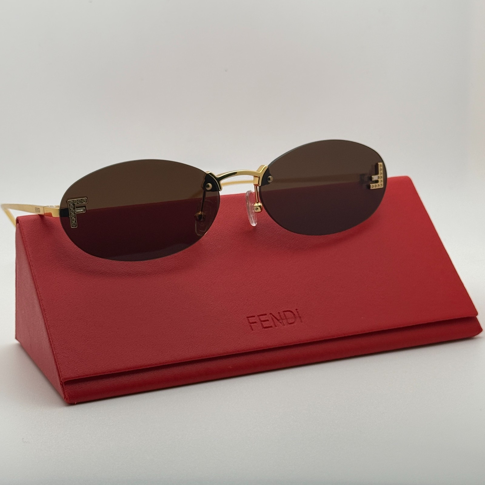 Fendi FE4075US Rimless Oval Sunglasses Women Gold Frame Gray Gradient Lenses