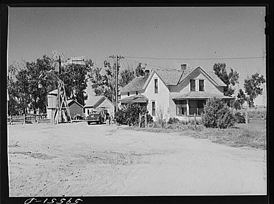 Photo:Mitchell Nebraska 1930s Farm Buildings Home Windmill Car Near Town