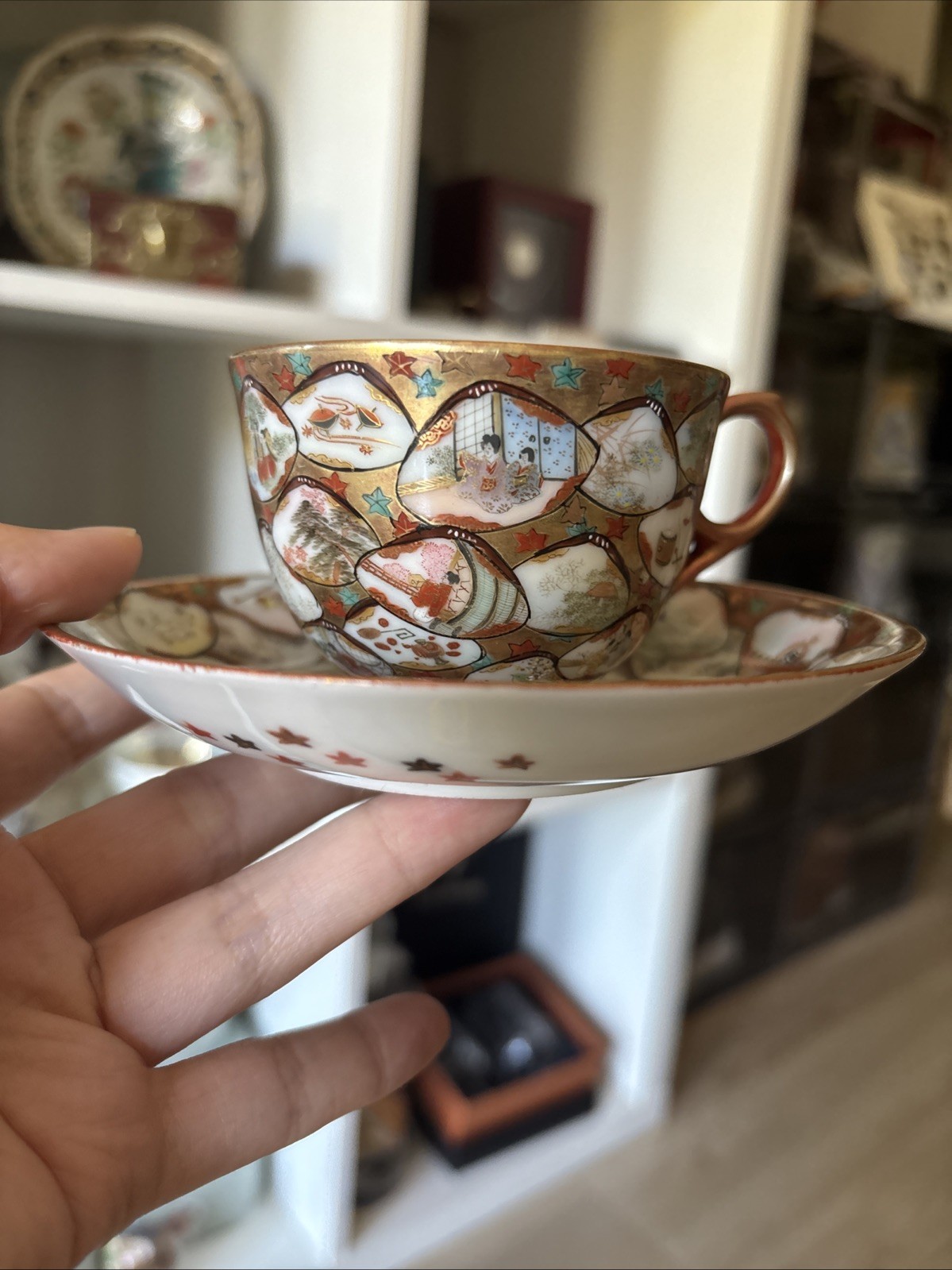 Very detailed antique Japanese porcelain tea cup and saucer set hand-painted Very detailed antique Japanese porcelain tea cup and saucer set hand-painted