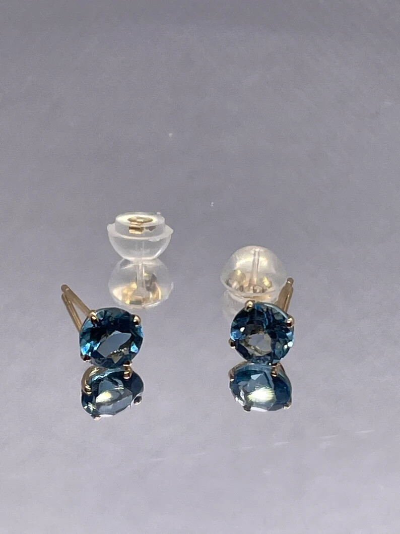 14k solid yellow gold stud earrings with .70ct genuine blue topaz gemstones 14k solid yellow gold stud earrings with .70ct genuine blue topaz gemstones