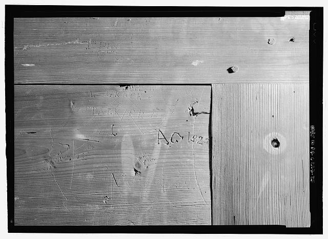 Photo:1900s Interior Graffiti on Wooden Partition Wall Close-Up