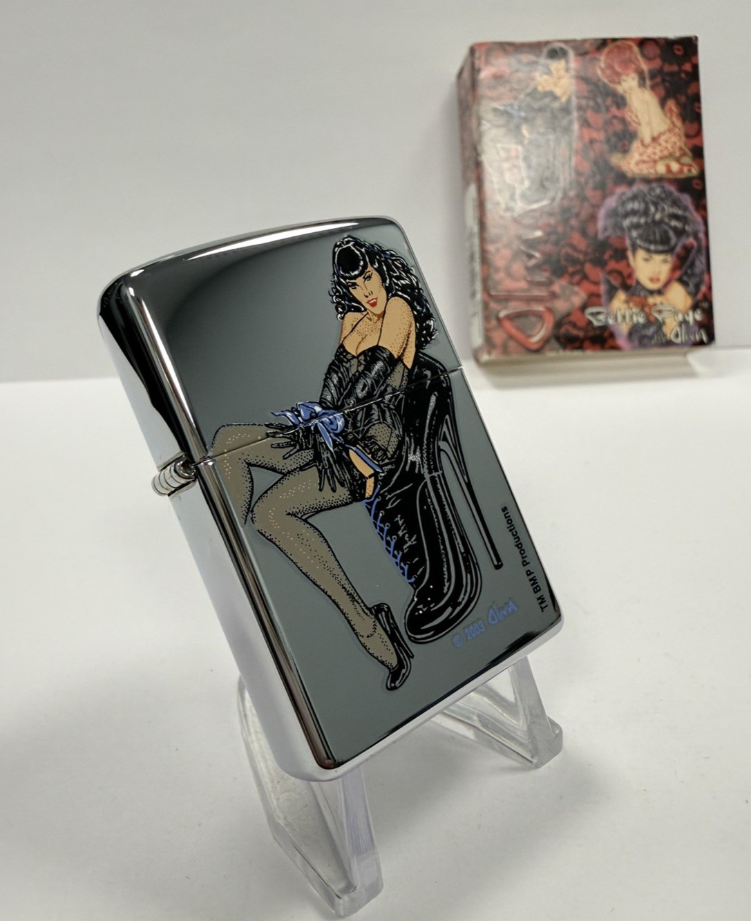 GENUINE Zippo Lighter SEXY OLIVIA BETTIE BONDAGE Polished Chrome 2003 NEW IN TIN