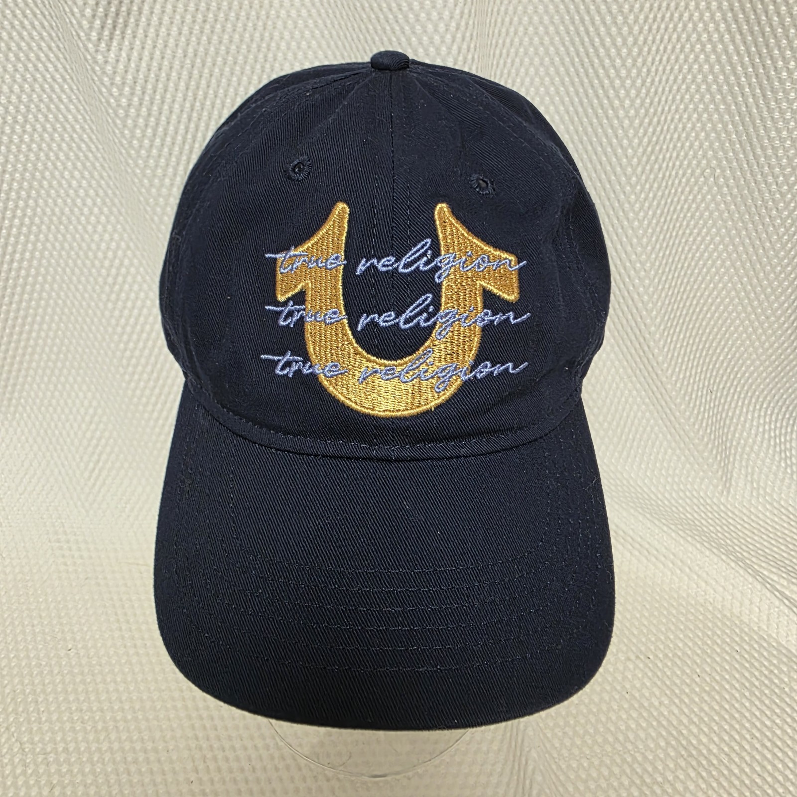 NWT True Religion Baseball Cap Hat Dark Blue Hat With Gold and Light Blue Logo NWT True Religion Baseball Cap Hat Dark Blue Hat With Gold and Light Blue Logo