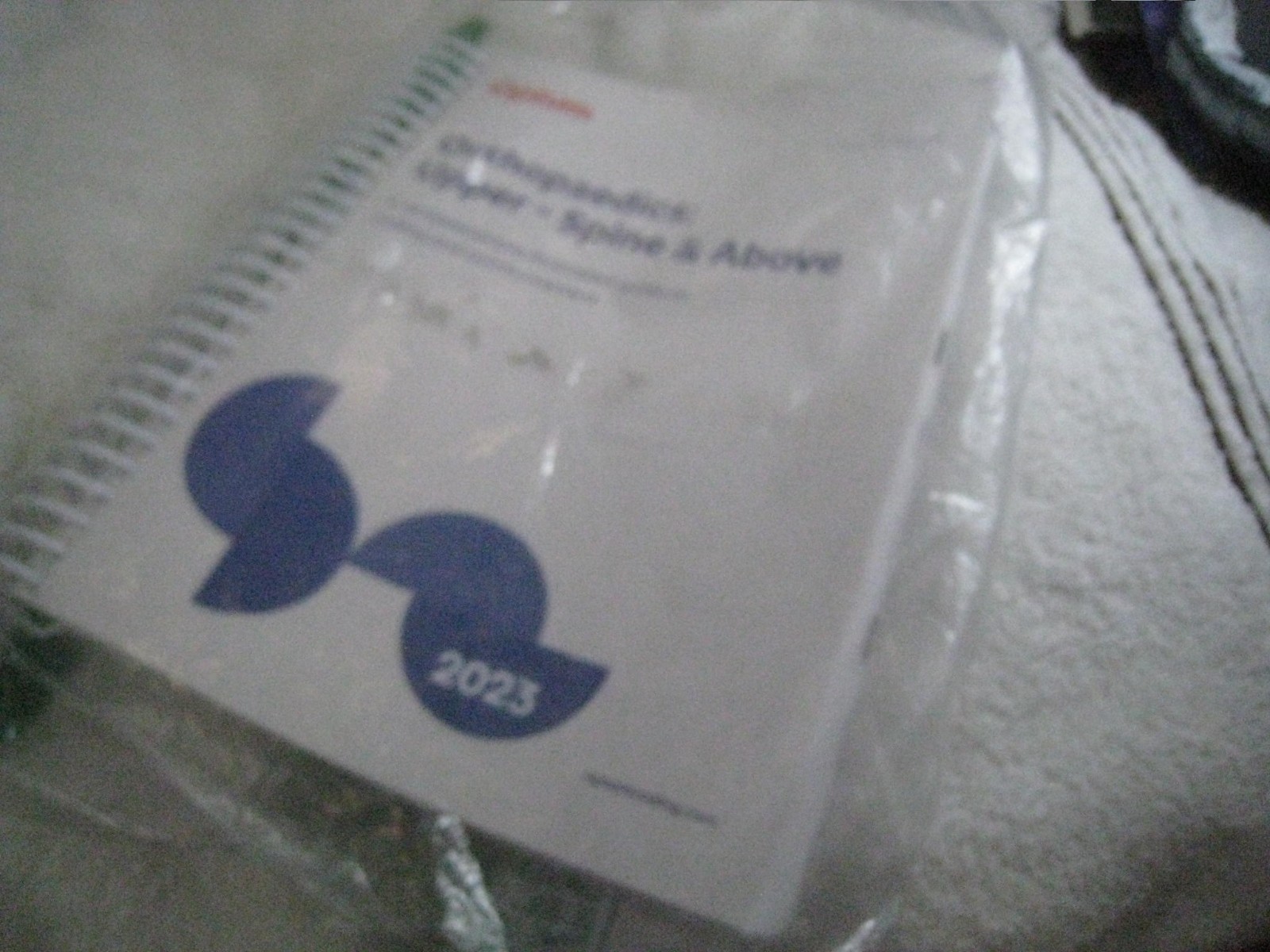Optum Coding Companion 2023 spiral bound textbook Orthopaedics: Upper Spine,