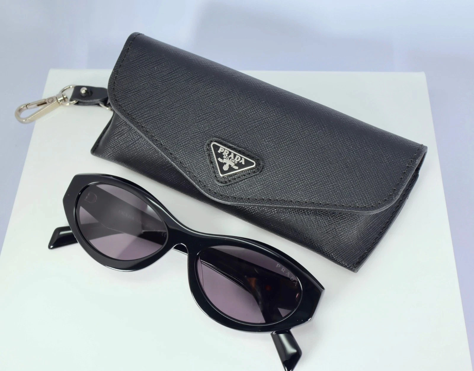 Prada PR 26ZS 16K08Z Women\'s Oval Sunglasses in Black with Gray Lens Prada PR 26ZS 16K08Z Women\'s Oval Sunglasses in Black with Gray Lens