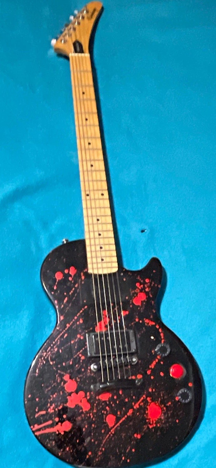 Epiphone Solid Body Electric Guitar Black Red Splatter Finish 6-String RH Epiphone Solid Body Electric Guitar Black Red Splatter Finish 6-String RH