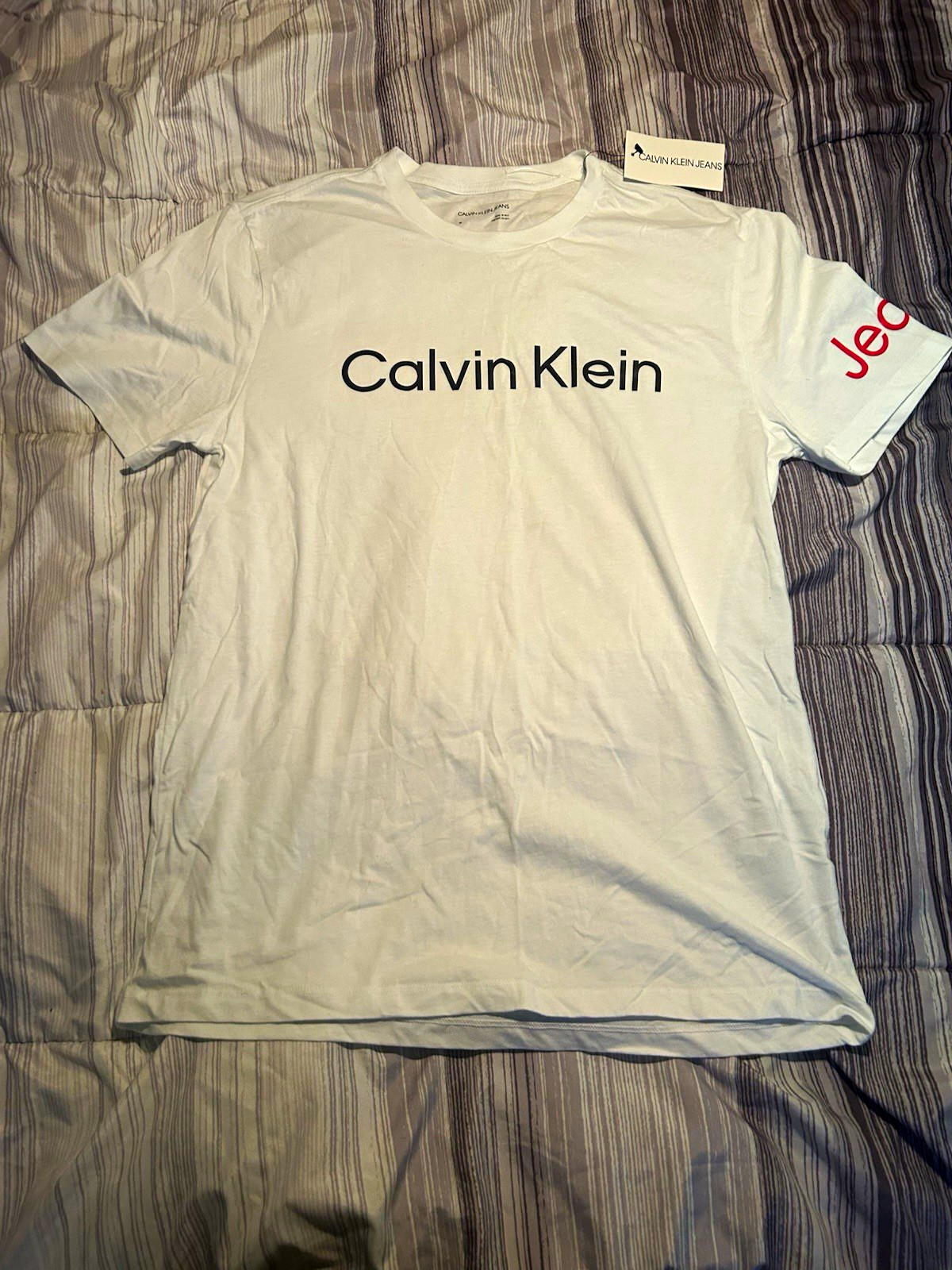 Calvin Klein Jeans Men’s White Graphic Logo Crew Neck Short Sleeve T-Shirt, M Calvin Klein Jeans Men’s White Graphic Logo Crew Neck Short Sleeve T-Shirt, M