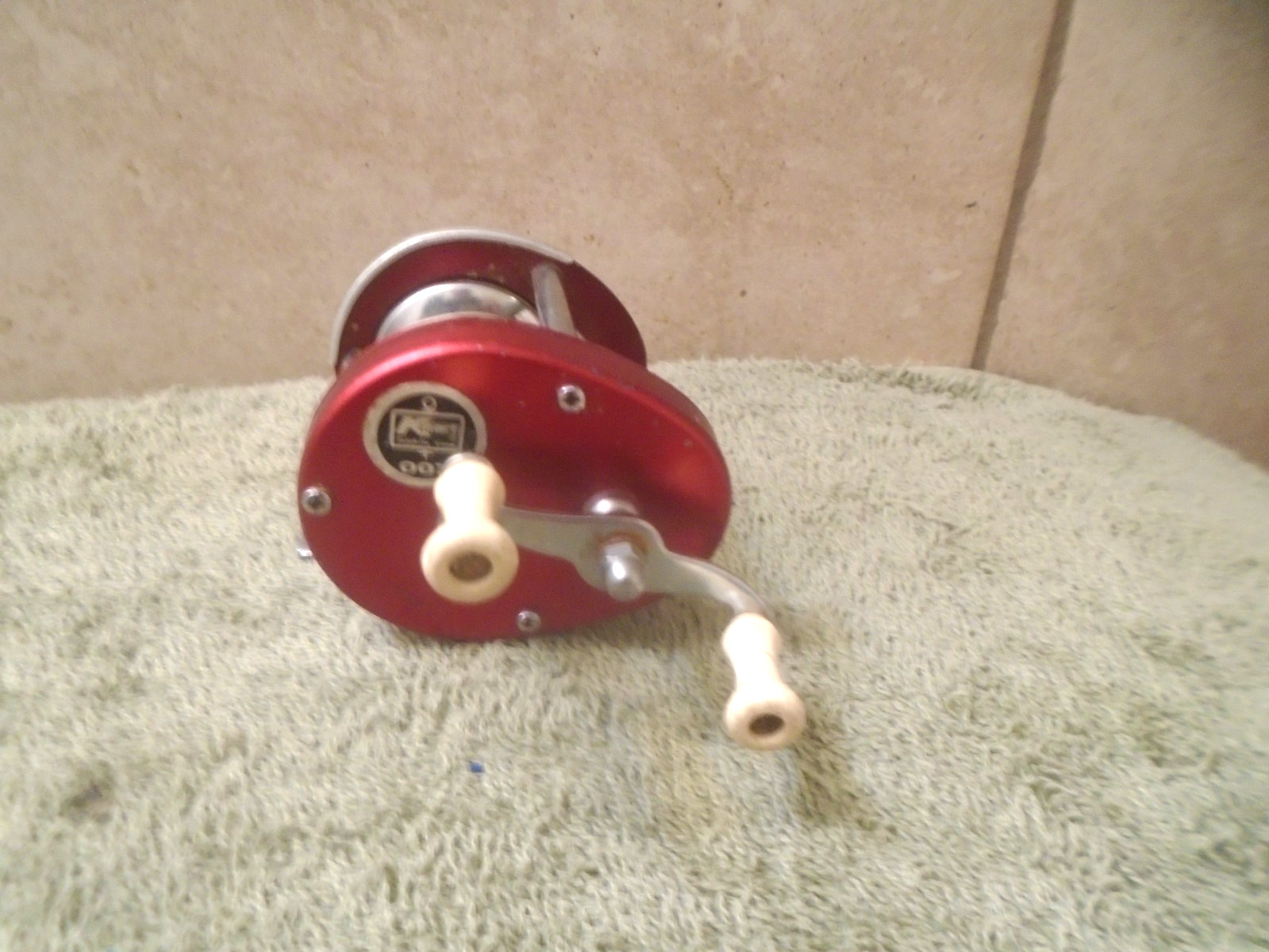 Vintage Kmart 007 Fishing Reel spins and casts freely