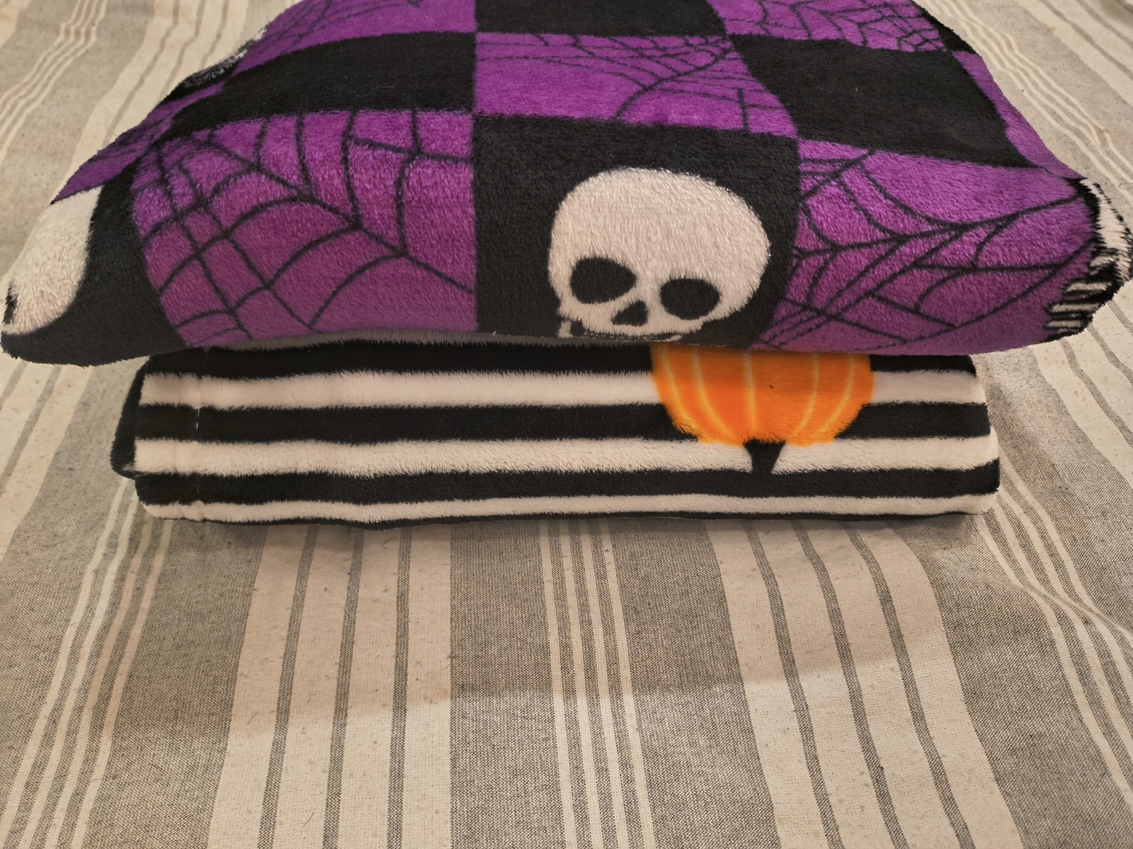 Purple & Black Checkered Skull Spiderweb Halloween Throw Blanket, Striped Edge