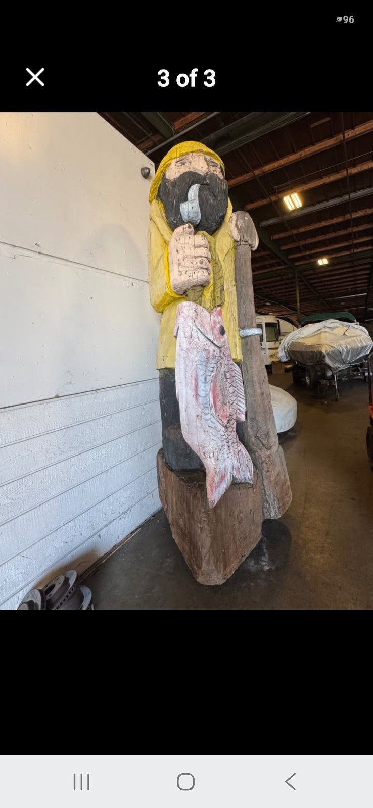 10\' tall wooden carved fisherman 