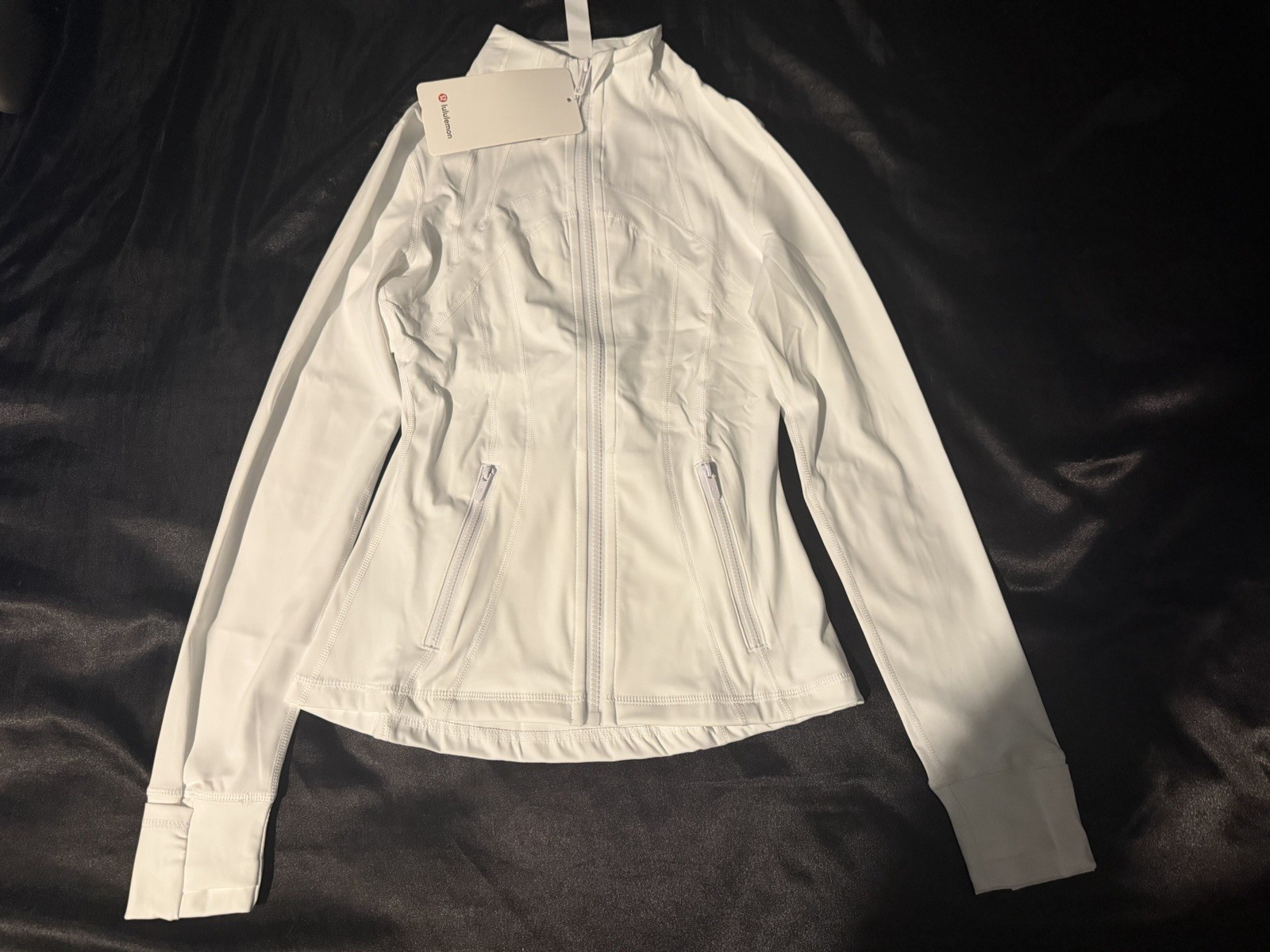 Lululemon white  Define women’s track  Jacket Size 2 Full Zip pockets stretch 
