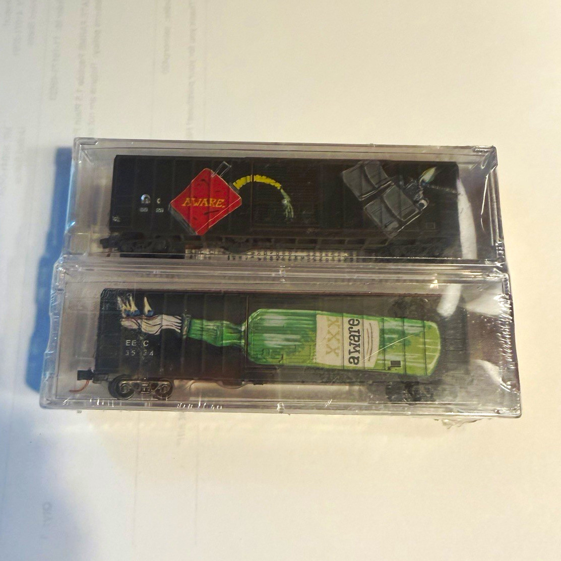 Micro-Trains Line N Scale 50\' Rib Side Single Door AWARE Graffiti w/ Handstyle