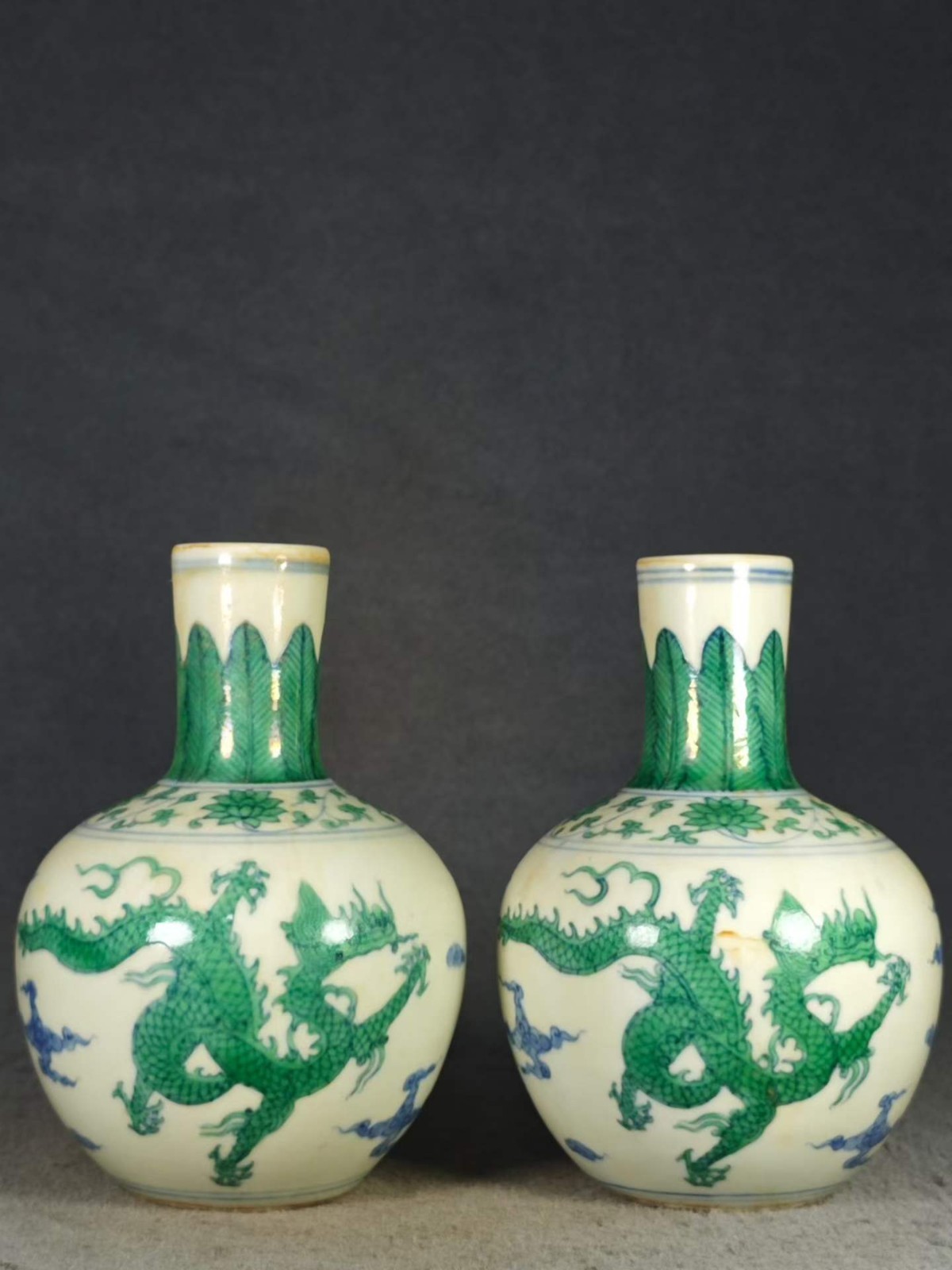 A pair of antique Chinese Chenghua-style green dragon-patterned celestial globe A pair of antique Chinese Chenghua-style green dragon-patterned celestial globe