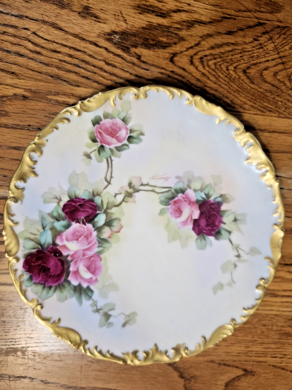 Ant. T & V Limoges porcelain plate hand painted pink/red roses, w/gold gilt trim Ant. T & V Limoges porcelain plate hand painted pink/red roses, w/gold gilt trim