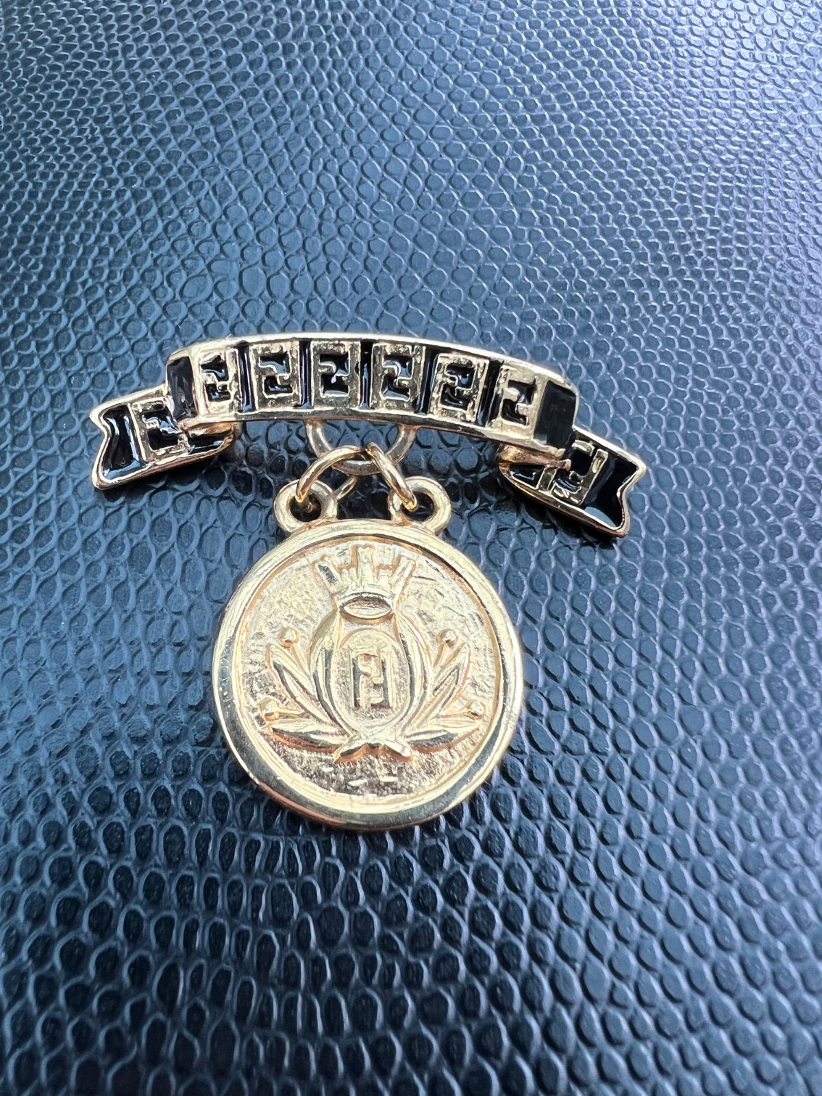 Vintage FENDI Logo Coin Medallion Charm Brooch Gold Tone Black Enamel Ribbon Vintage FENDI Logo Coin Medallion Charm Brooch Gold Tone Black Enamel Ribbon