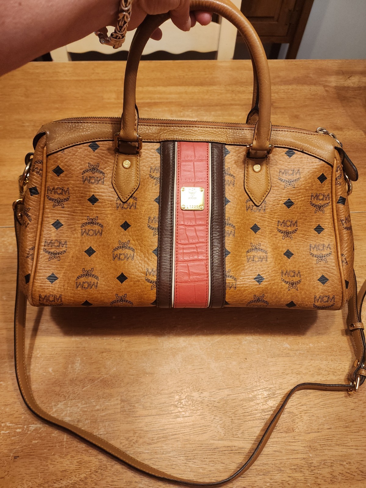 MCM Visetos monogram satchel featuring a distinctive red and brown embossed... MCM Visetos monogram satchel featuring a distinctive red and brown embossed...