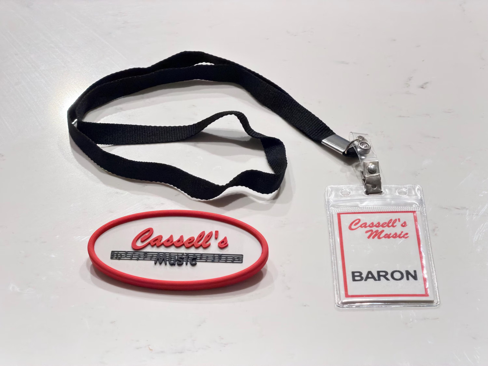 Cassell’s Music Pin and Lanyard, Obsession Movie Shirt Patch (2026) Cassell’s Music Pin and Lanyard, Obsession Movie Shirt Patch (2026)