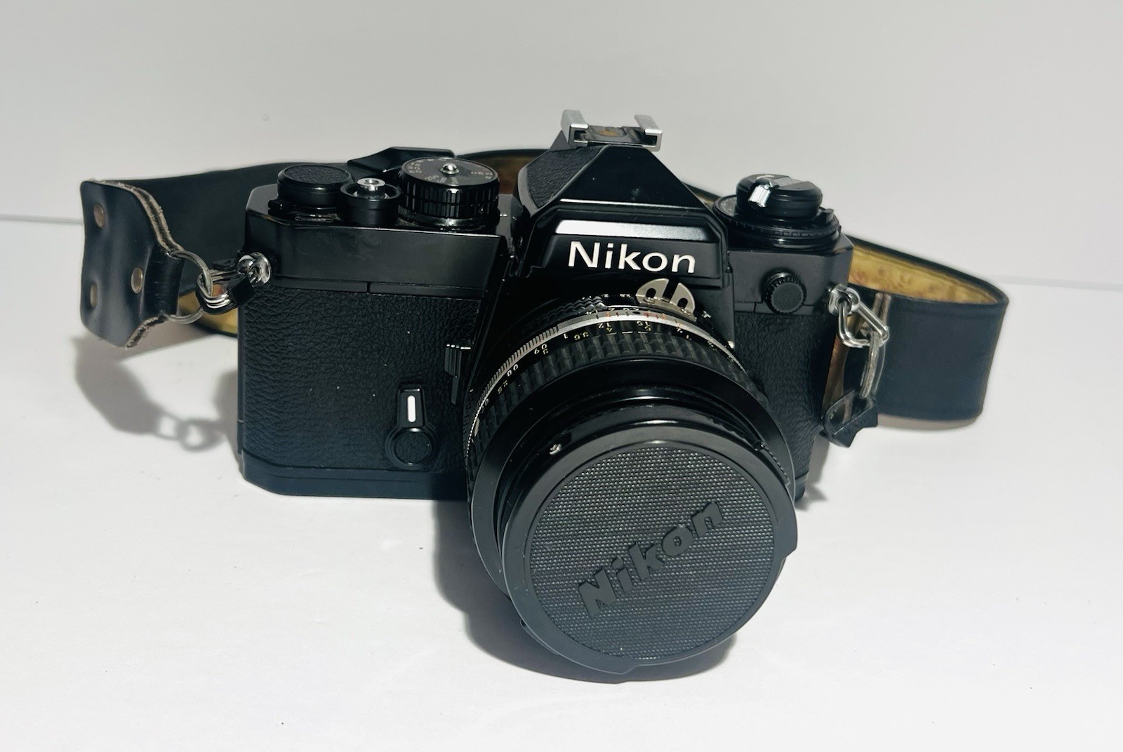 Nikon FE 35mm SLR Film Camera Black With Nikkor 50mm f1.4 Lens & Leather Case Nikon FE 35mm SLR Film Camera Black With Nikkor 50mm f1.4 Lens & Leather Case