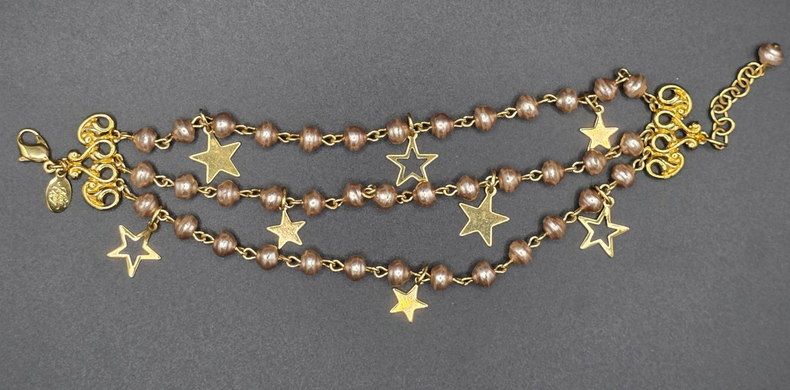 Signed Kirks Folly Light Pink Faux Pearl 3 strand with Star Dangles Bracelet Signed Kirks Folly Light Pink Faux Pearl 3 strand with Star Dangles Bracelet
