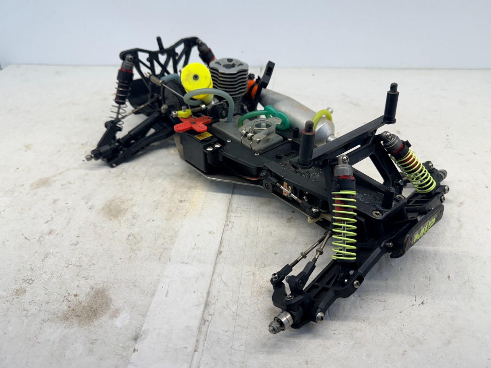 ROUGH Used Traxxas Nitro Rustler 1/10 Scale Buggy Slider Parts Chassis 0012