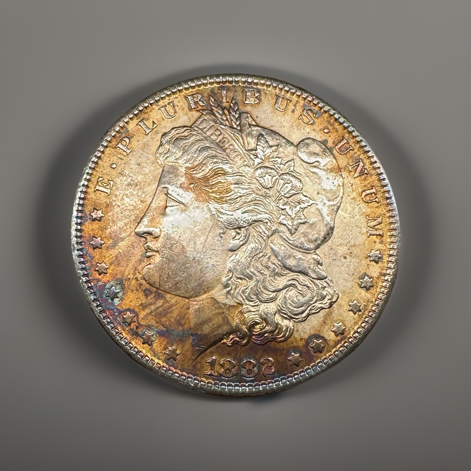 1882-P- BU Morgan Dollar – Vibrant AT Rainbow Toning – Beautiful Eye Appeal