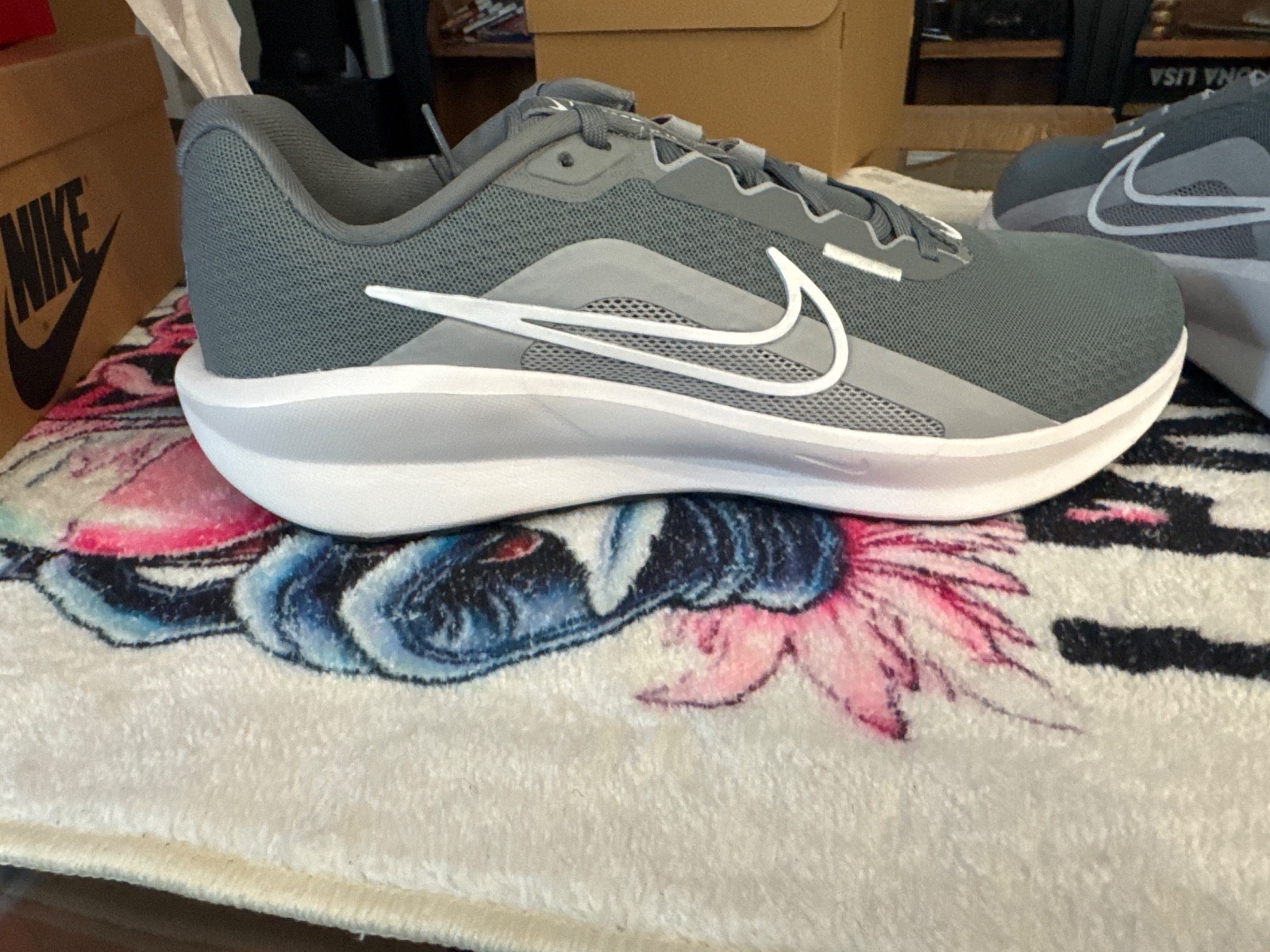 Nike Downshifter 13 running shoe featuring a contrasting white Swoosh on the br Nike Downshifter 13 running shoe featuring a contrasting white Swoosh on the br