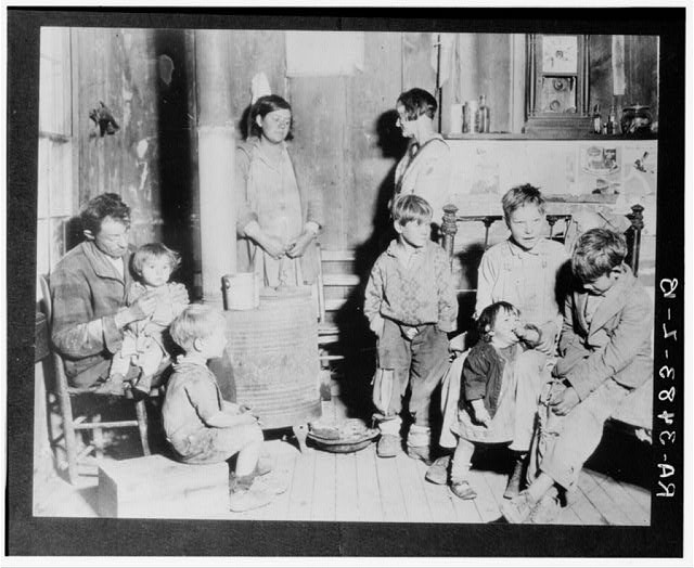 Photo:1900s Interior Family of Nine Cabin Homestead Children Portrait