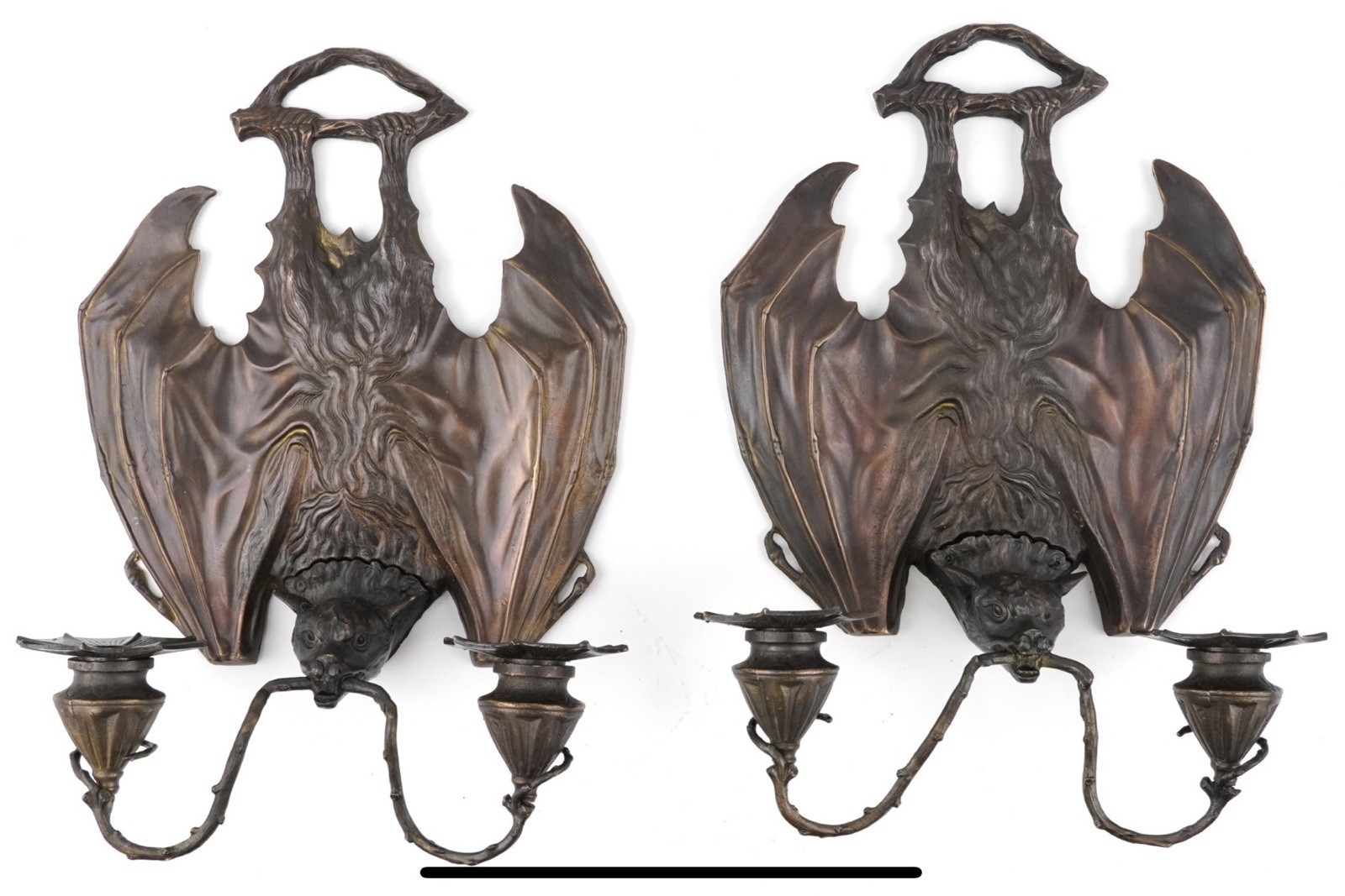 A pair of Art Nouveau style patinated bronze bat gothic design wall sconces A pair of Art Nouveau style patinated bronze bat gothic design wall sconces