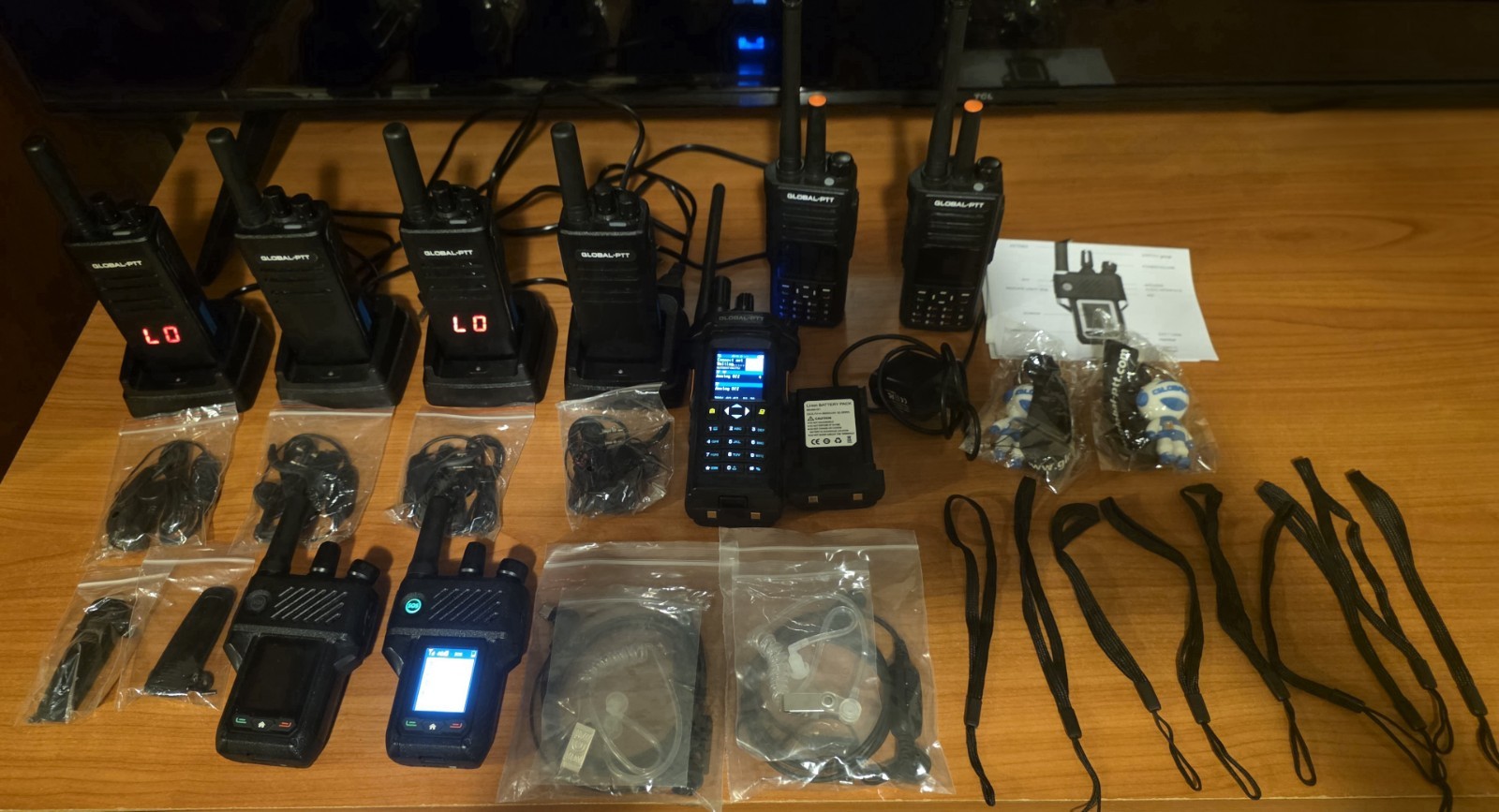 9 Pack GLOBAL-PTT LTE and Analog Portable 2-Way Radio Lot w/ Chargers, Earpieces