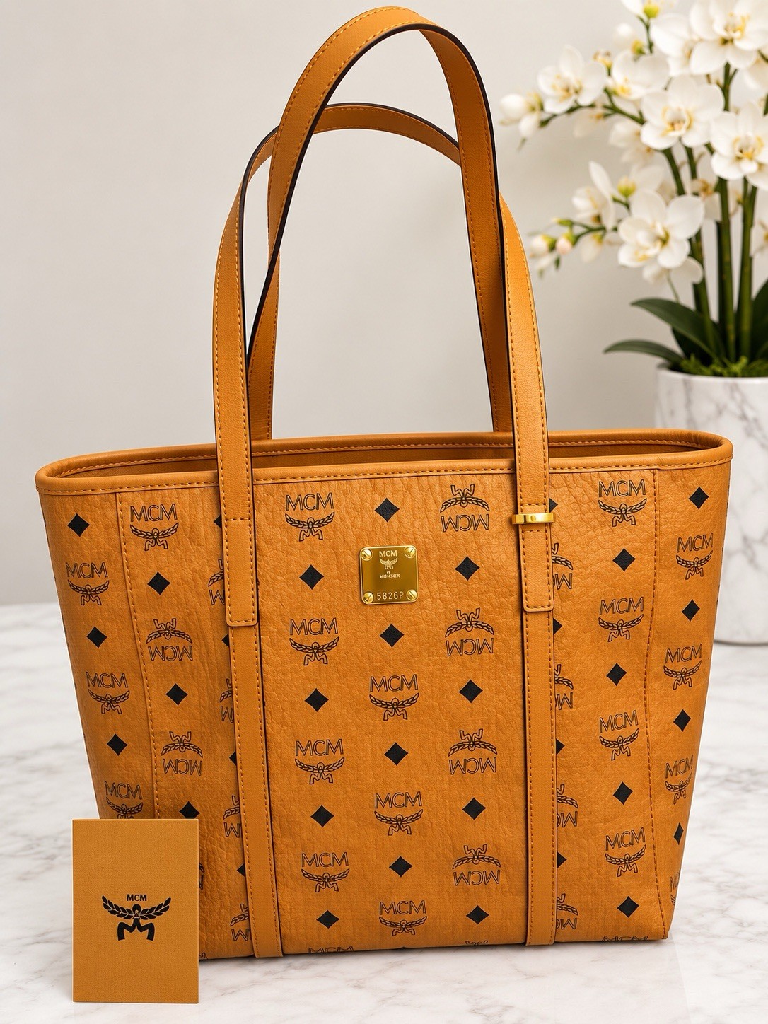 MCM Women’s Cognac Monogram Logo Tote Zip Top Gold Hardware Inner Pockets MCM Women’s Cognac Monogram Logo Tote Zip Top Gold Hardware Inner Pockets