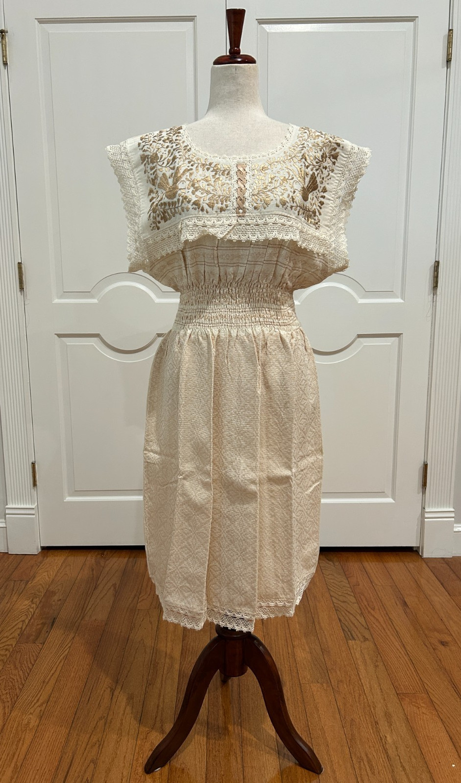 Mexican Paloma dress made of handwoven fabric with 100 % handmade embroidery.