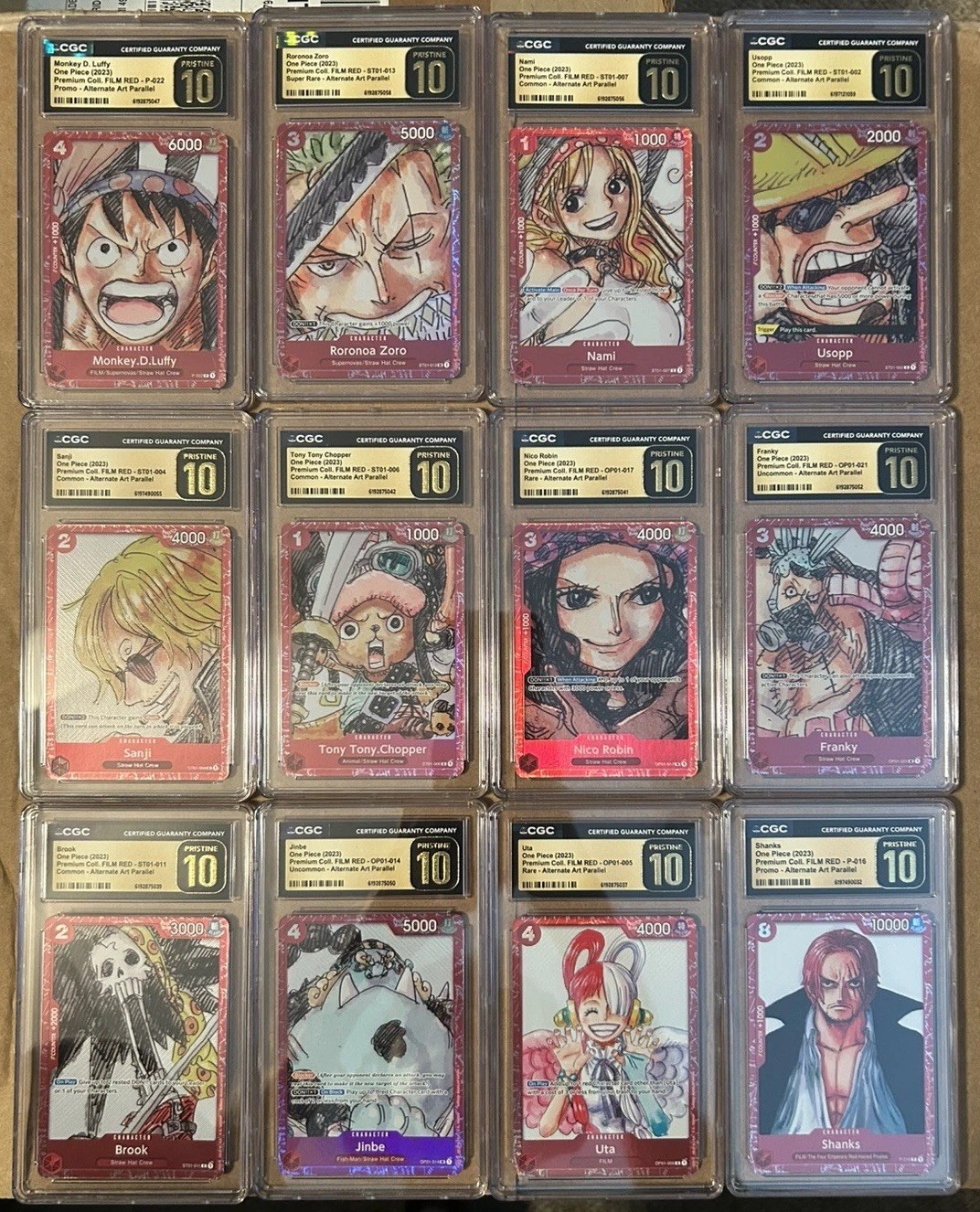 CGC 10 PRISTINE One Piece Film Red Premium Card Collection Set of (12) CGC 10 PRISTINE One Piece Film Red Premium Card Collection Set of (12)