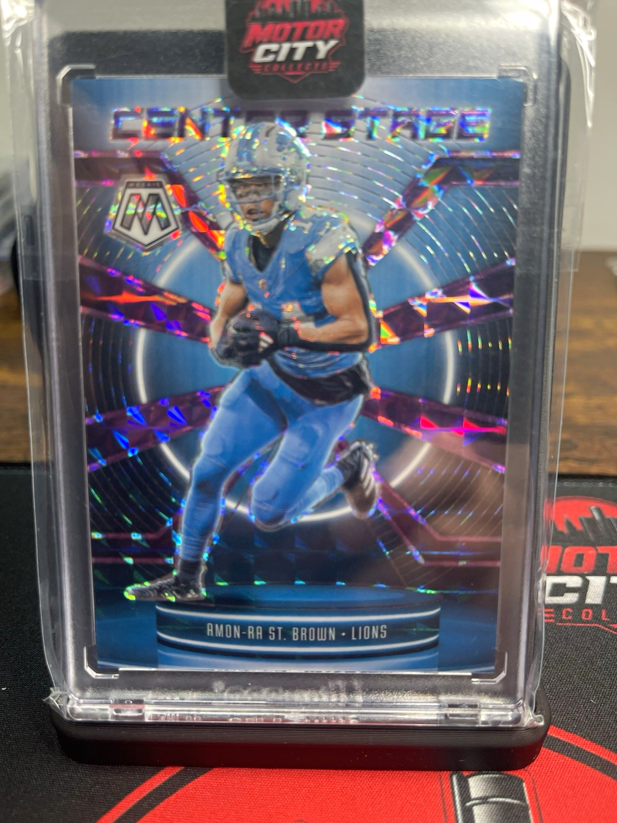 Panini Mosaic 2025 Amon-Ra St. Brown Lions Center Stage Purple Prizm /49 Panini Mosaic 2025 Amon-Ra St. Brown Lions Center Stage Purple Prizm /49