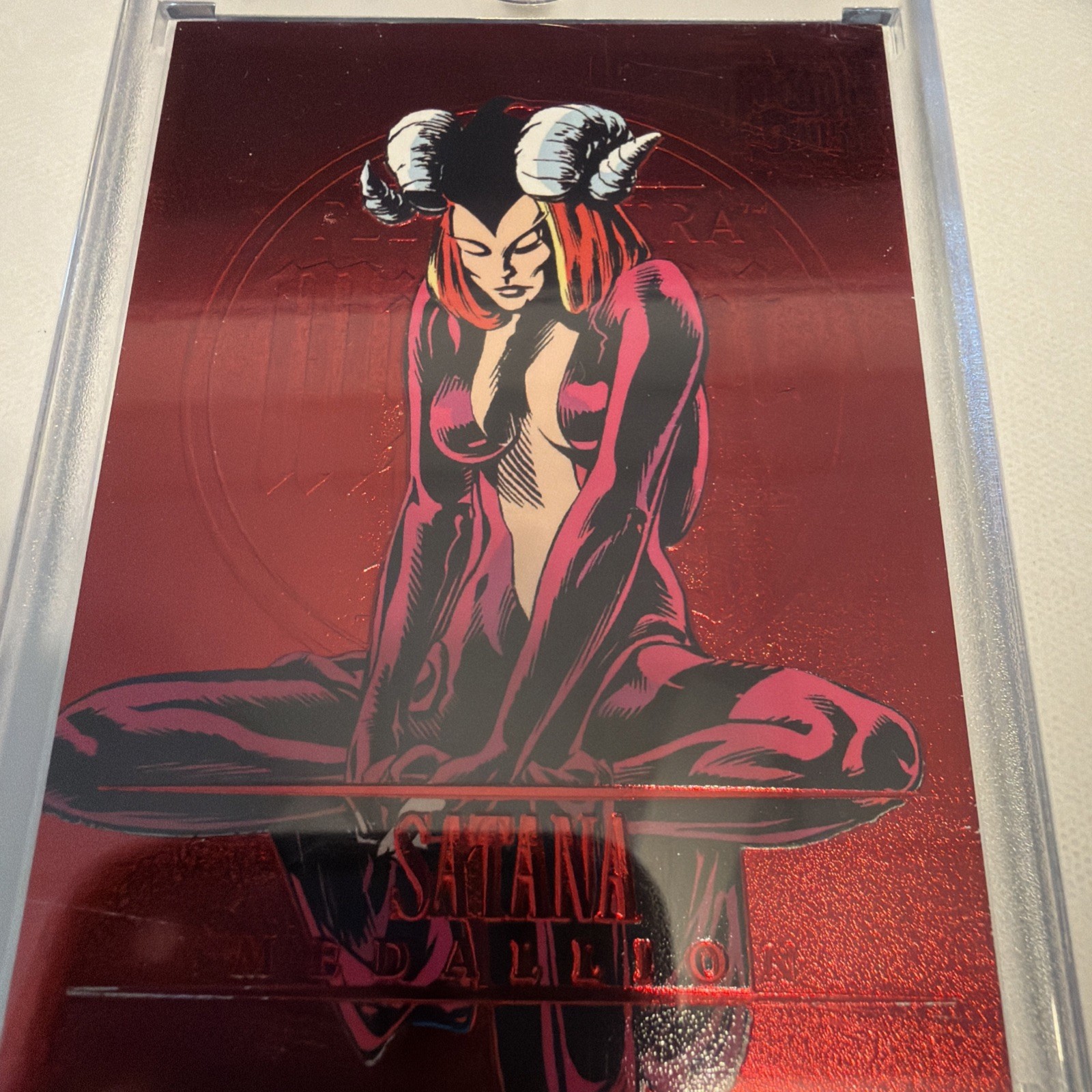 2023 Fleer Ultra Midnight Sons Medallions Ruby Red 40/50 Satana #M-38 2023 Fleer Ultra Midnight Sons Medallions Ruby Red 40/50 Satana #M-38