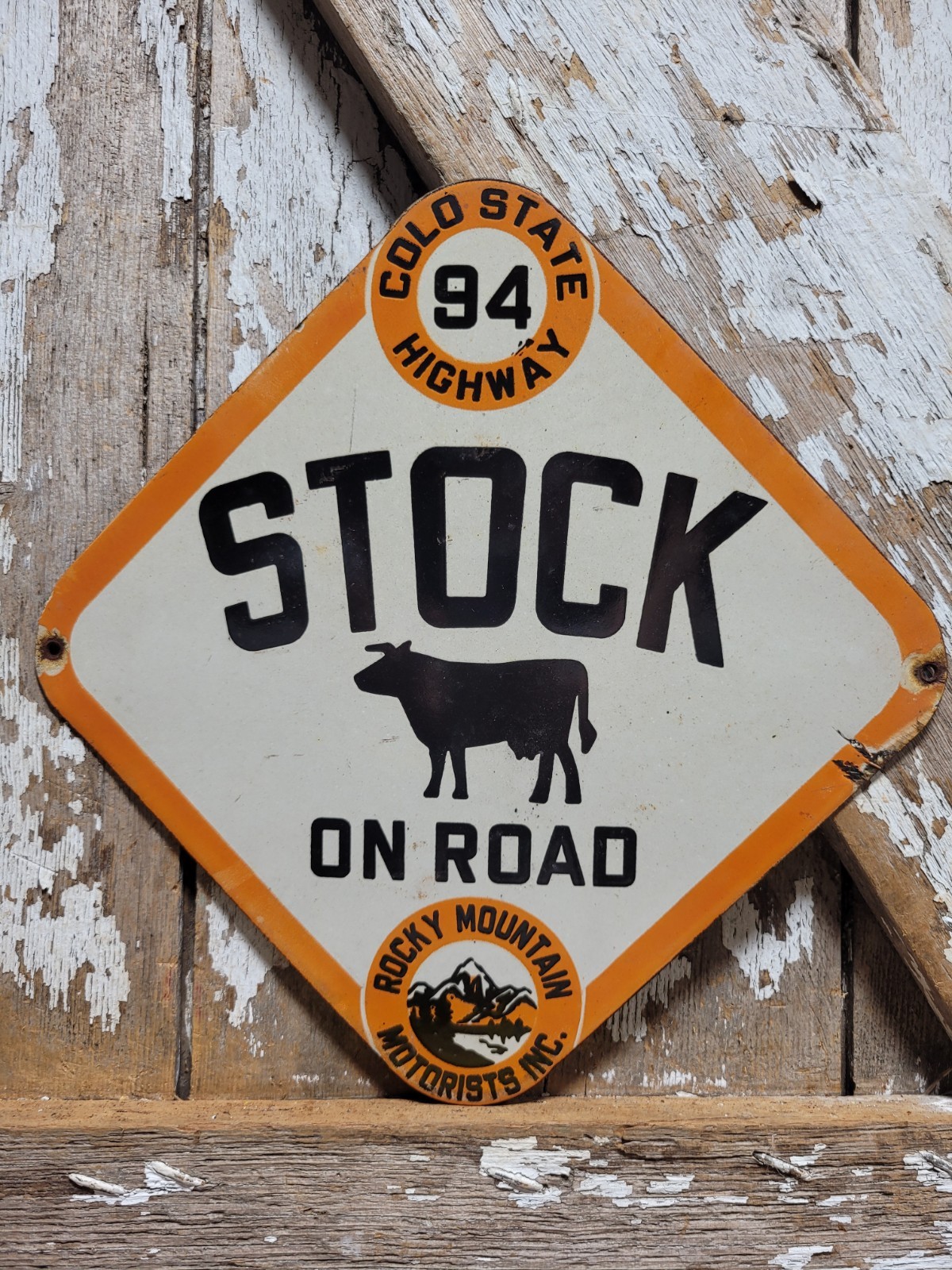 VINTAGE ROCKY MOUNTAIN MOTORISTS PORCELAIN SIGN OLD COLORADO HIGHWAY COW CATTLE