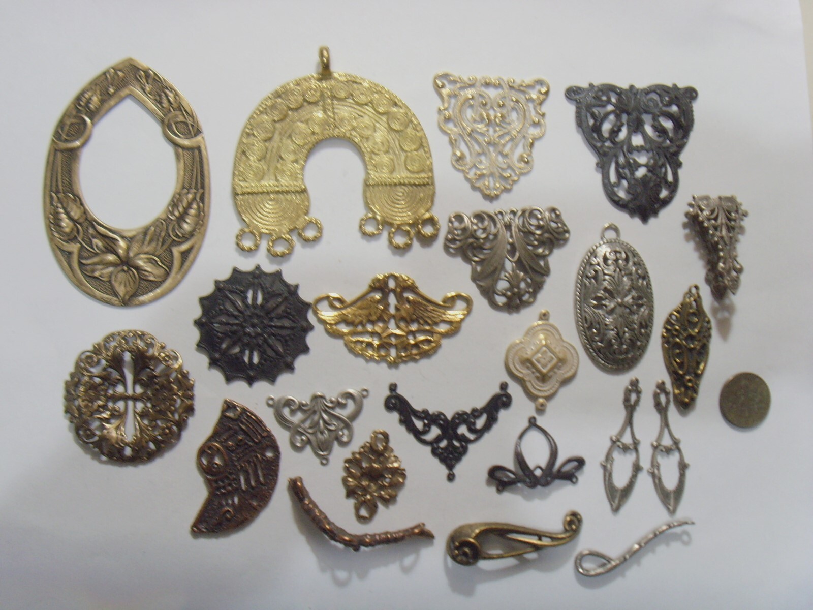 23 antique assorted metal sculptured ornaments and other shapes lot 53526