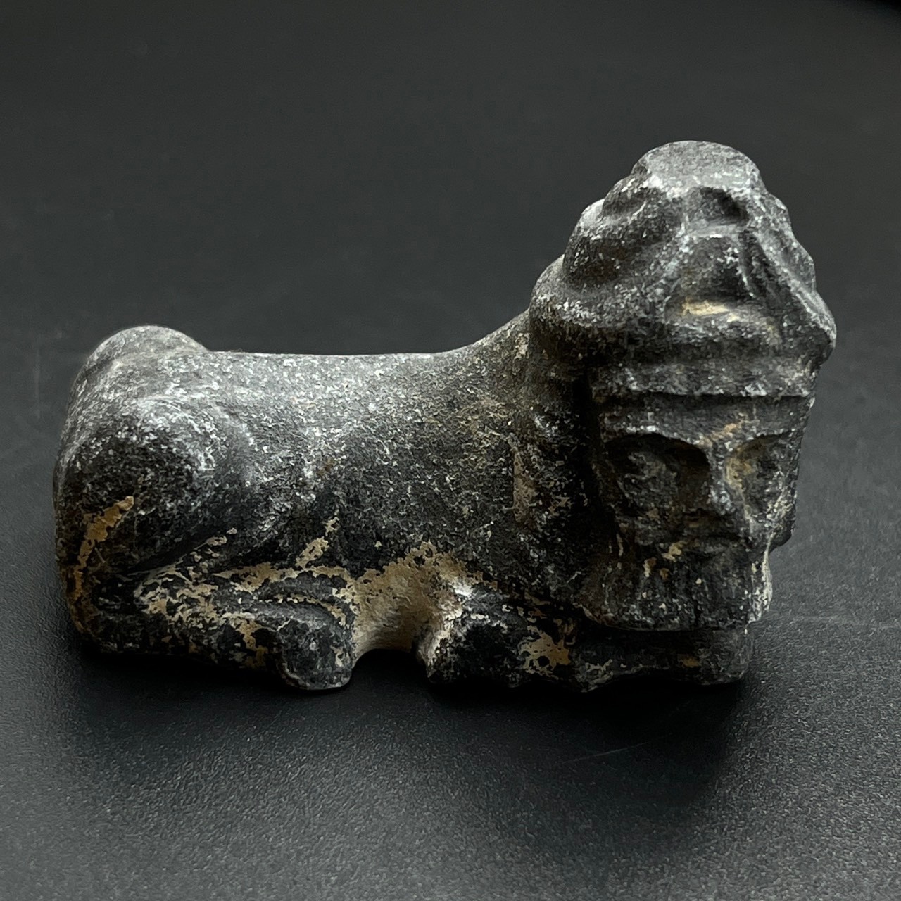 Ancient near eastern bearded mythical stone figure