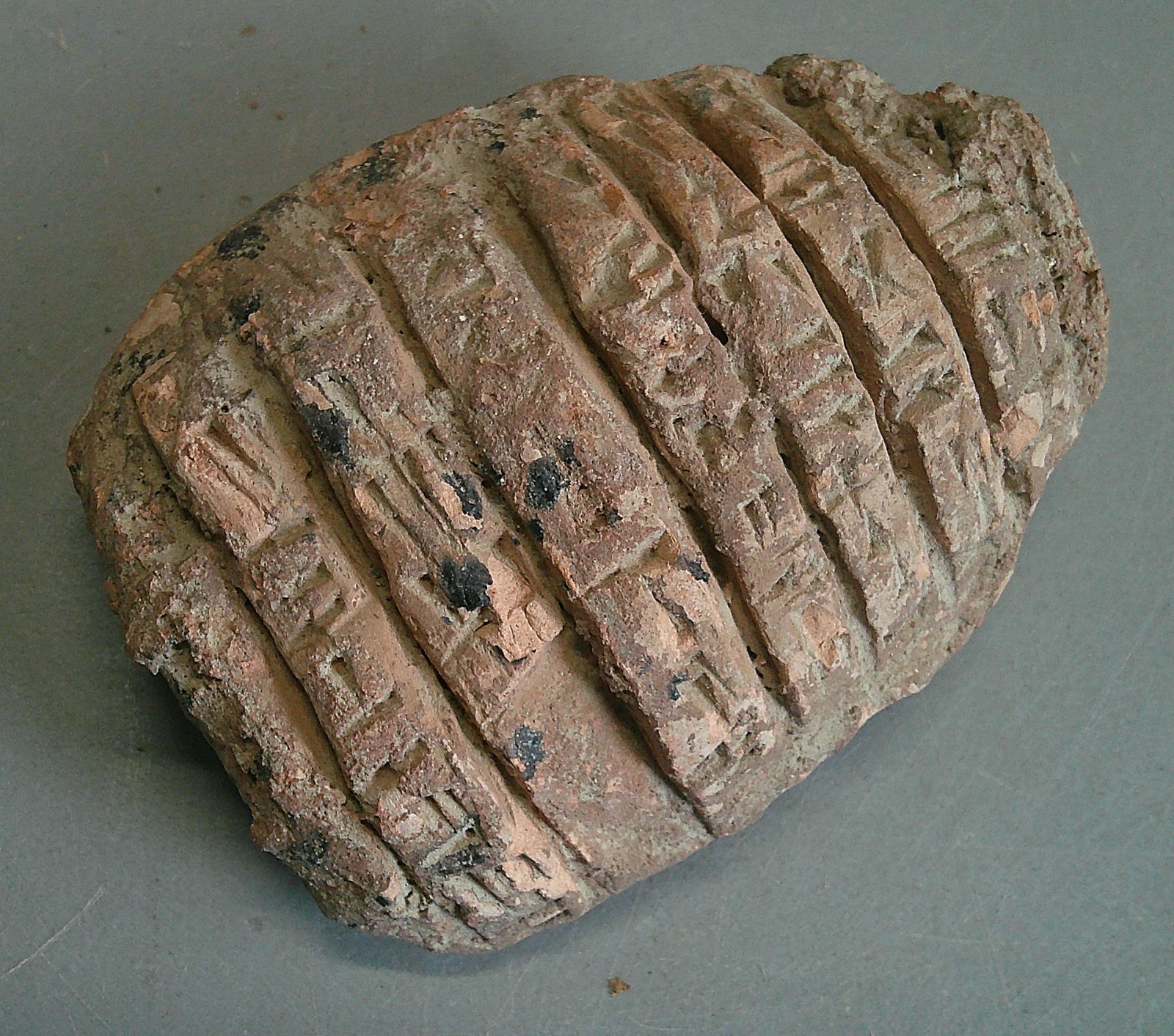 Near Eastern terracotta tablet with early form of writing Near Eastern terracotta tablet with early form of writing