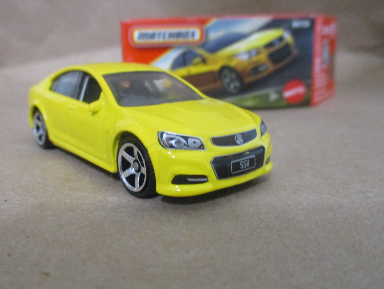 Matchbox 1-125 series #84 Holden VF Commodore SSV Yellow  1/64 Scale Diecast