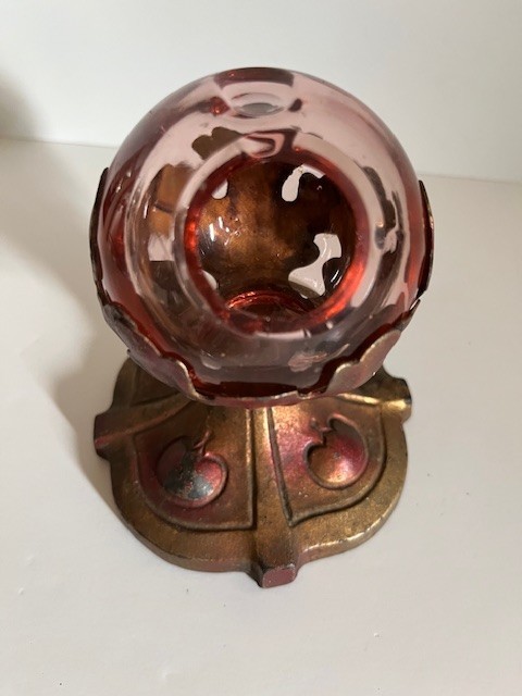 Art deco glass ball ashtray on cast iron pedestal; likely Jefferson Glass
